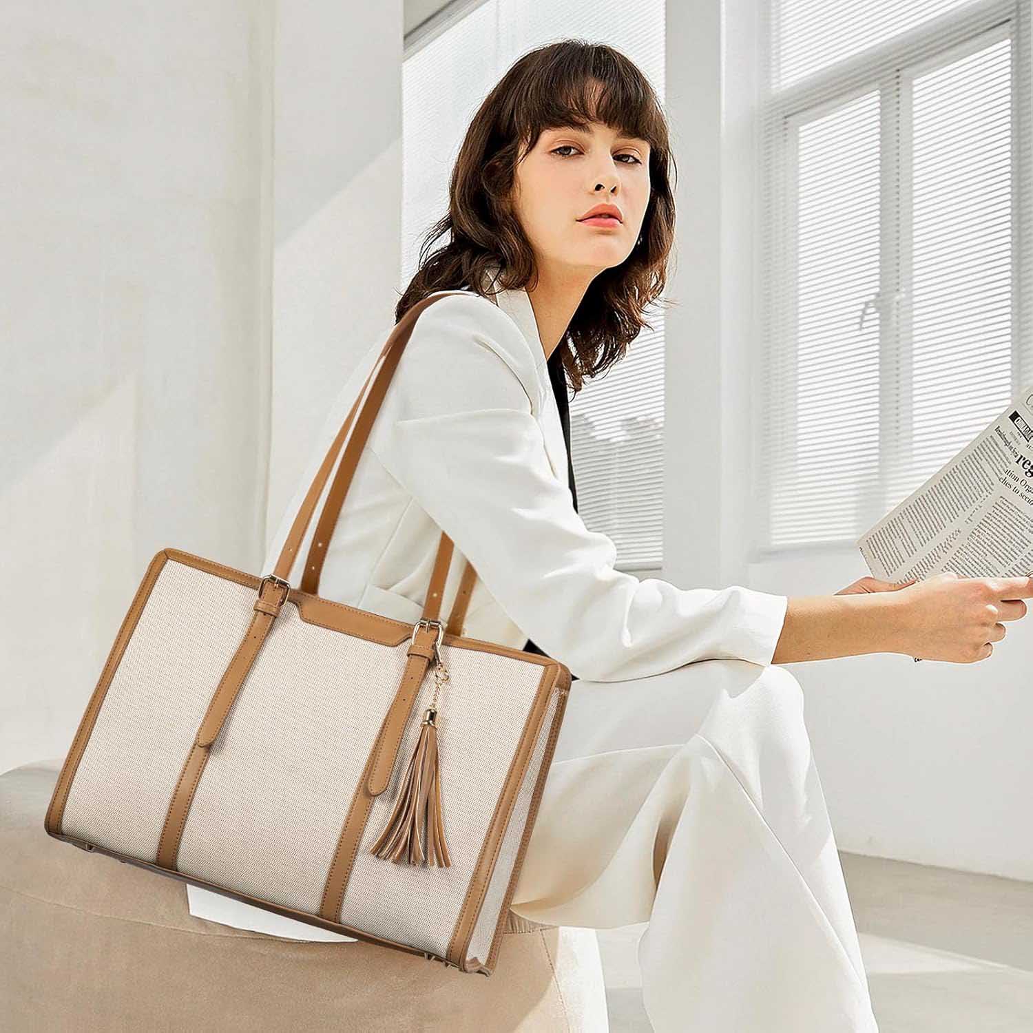 Woman wearing canvas leather tote bag in white suit
